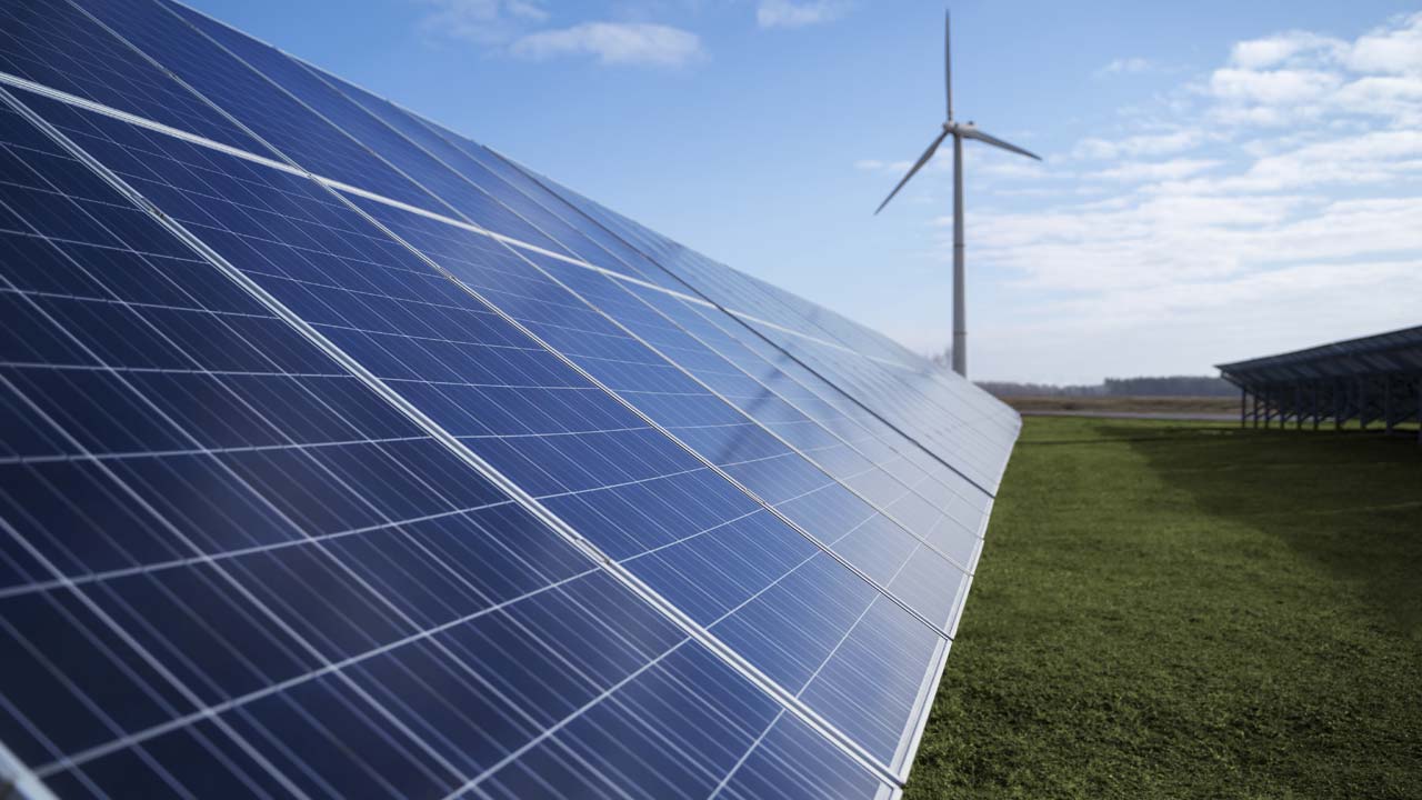 Home with rooftop solar panels and battery storage
