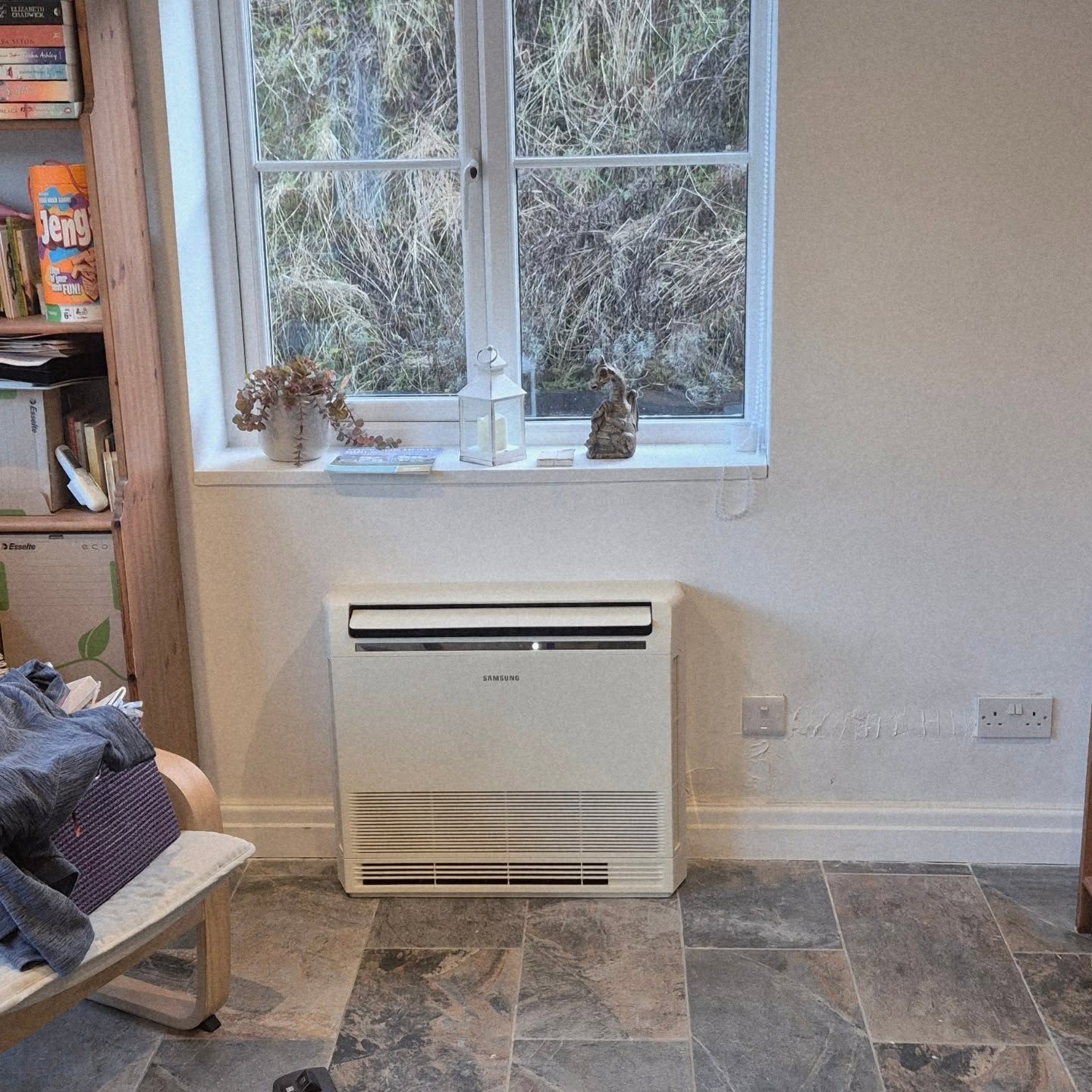 Samsung floor console heat pump unit fitted below a window