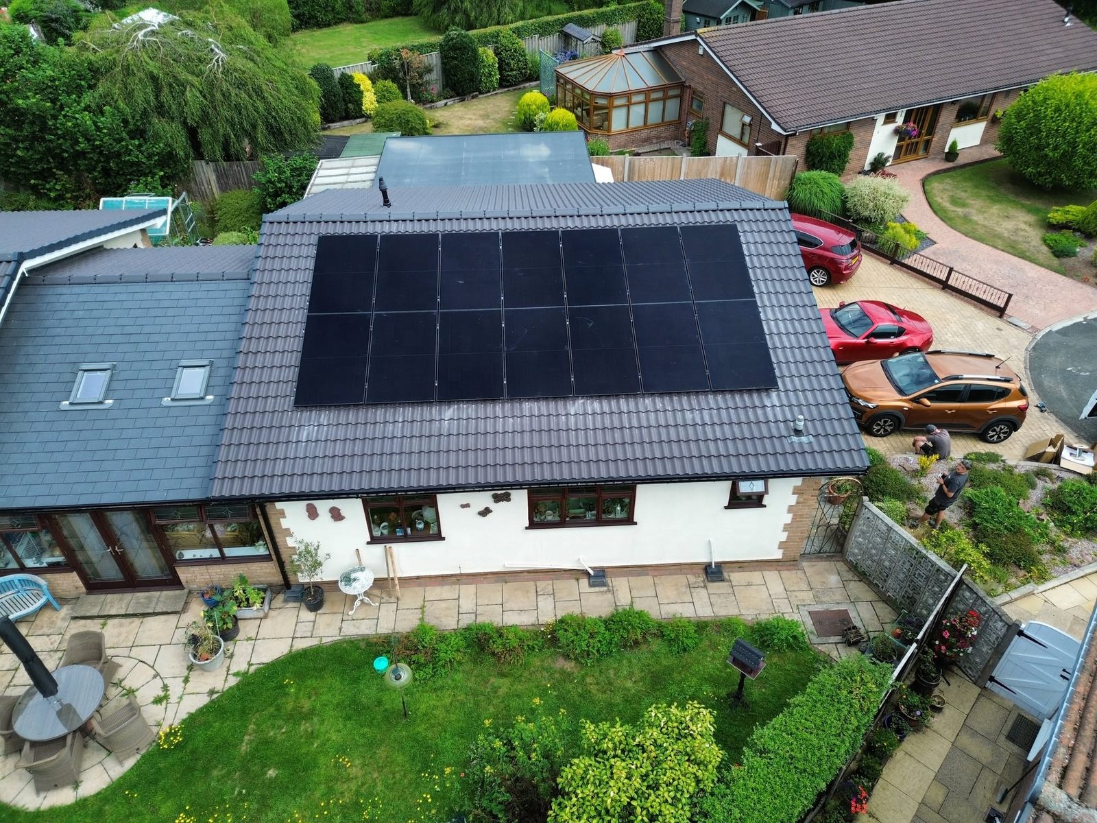 Solar panels on a Neston bungalow and outbuilding from above